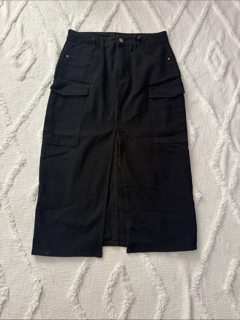 Black denim skirt with side pockets... I don't know the brand because there is n